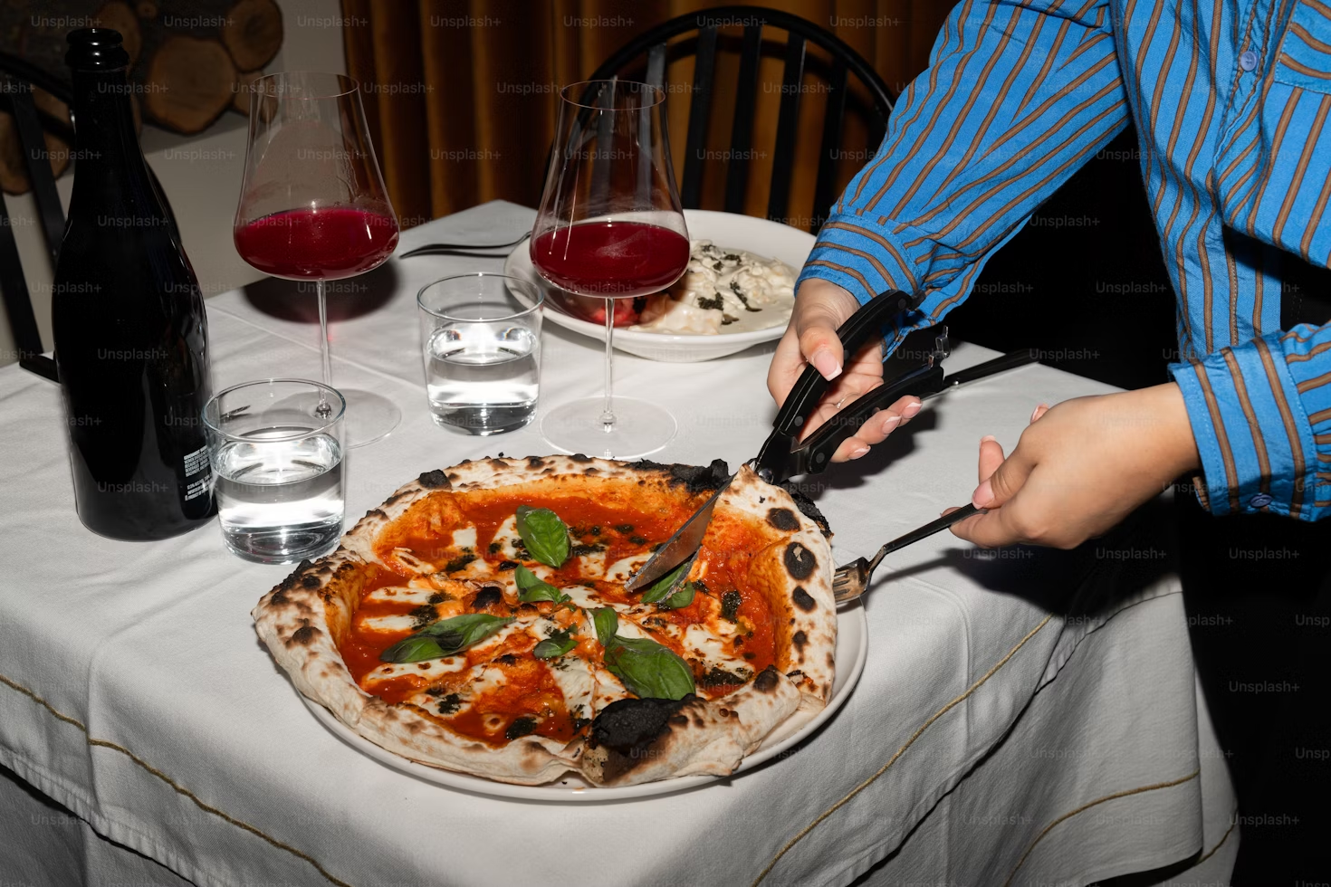 Close‑up of pizza crust and basil